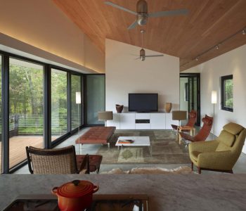 Extraordinary-Modern-Fan-Company-Home-Living-Room-Modern-With-Beige-Wall-And-Beige-Wall-Beige-Wall-Ceiling-Fan-Concrete-Floor-Floor-to-ceiling-Window